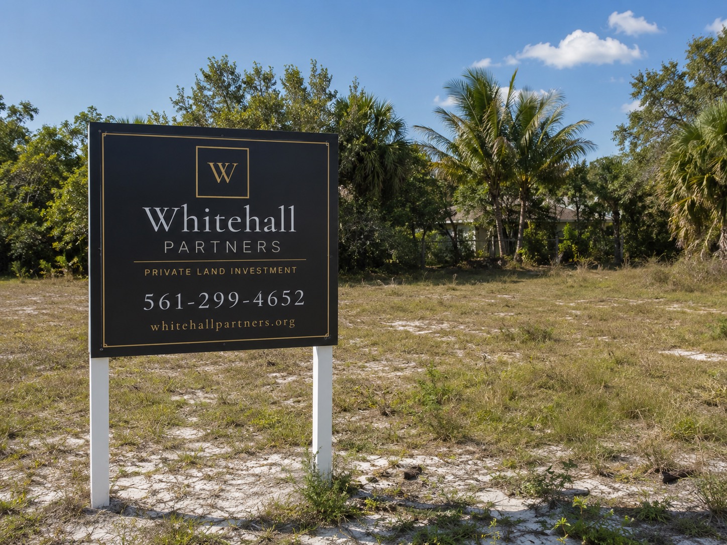 A Whitehall Partners sign on a vacant parcel of land in Florida